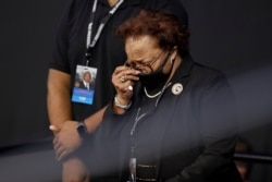 Ethel Mae Tyner, sister of the late John Lewis., dries her eyes during a service celebrating "The Boy from Troy" at Troy University, in Troy, Alabama, July 25, 2020.