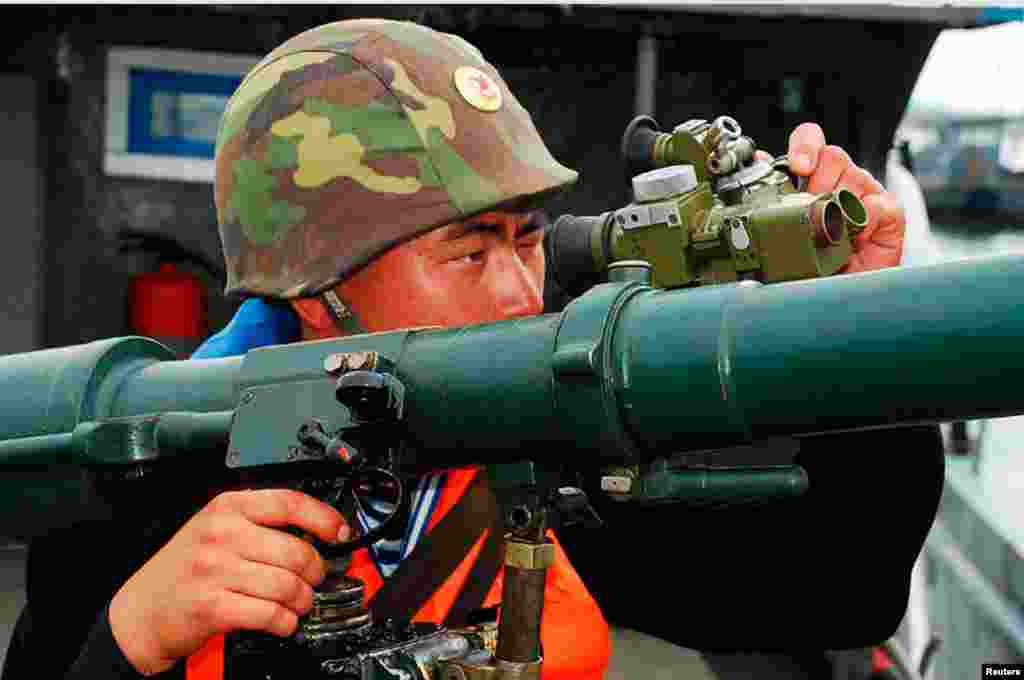 A North Korean soldier attends military training in an undisclosed location in this picture released by the North's official KCNA news agency, March 19, 2013. 