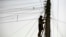 FILE - An Afghan man repairs electricity cables along the streets of Kabul, Nov. 16, 2009. The country is negotiating for an increase in energy supplies from its Central Asian neighbors.