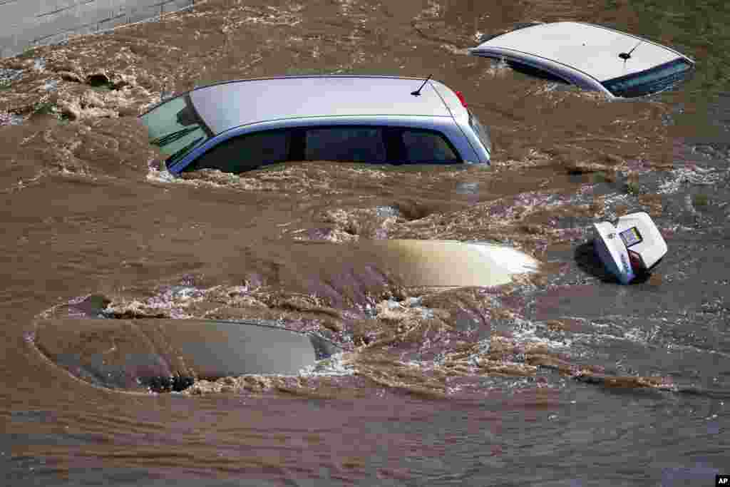 Vehicles are under floodwater from Schuylkill River in the Manayunk section of Philadelphia, in the aftermath of downpours and high winds from the remnants of Hurricane Ida that hit the area.