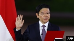 新加坡新总理黄循财在新加坡国家会议中心举行的仪式上宣誓就职。（2024年5月15日）