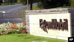 FILE - A sign marks the entrance of the Exxon Mobil cooperate headquarters in Irving, Texas, Oct. 30, 2003. 