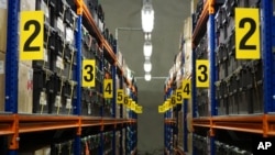 In this photo taken Sunday, Oct.18, 2015, rows of boxes containing seed samples sit inside the Global Seed Vault in Svalbard, Norway.