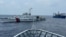 FILE - Two Chinese ships block a Philippine coast guard ship, foreground, headed for Second Thomas Shoal in the South China Sea, Oct. 4, 2023. The 2024 NATO summit is expected to touch on security and sovereignty issues in the area.