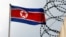FILE - A North Korea flag flutters next to concertina wire at the North Korean embassy in Kuala Lumpur, Malaysia March 9, 2017.