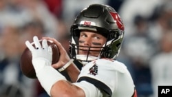 Tampa Bay Buccaneers quarterback Tom Brady (12) passes against the Dallas Cowboys during an NFL wild card playoff football game, Jan 16, 2023, in Tampa, Florida.