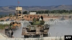 شماری از تندروان گروه حیات تحریر الشام سوریه (تصویر از آرشیف صدای امریکا)