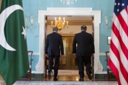 Secretary of State Mike Pompeo, right, meets Pakistani Foreign Minister Makhdoom Shah Mahmood Qureshi at the State Department in Washington, Tuesday, Oct. 2, 2018.