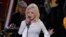 FILE - This Nov. 13, 2019, file photo shows Dolly Parton performing at the 53rd annual CMA Awards in Nashville, Tennessee. 