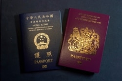 A British National Overseas passport (BNO) and a Hong Kong Special Administrative Region of the People's Republic of China passport are pictured in Hong Kong, Jan. 29, 2021.