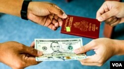 A mock-up image showing the receiving of passport in exchange for paying an extra fee. (Khan Sokummono/VOA Khmer) 