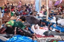 Ethiopian refugees who fled fighting in Tigray province lay in a hut at the Um Rakuba camp in Sudan's eastern Gedaref province, Nov. 16, 2020.