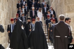 U.S. President Donald Trump, center left, and first lady Melania Trump visit the Church of the Holy Sepulchre in Jerusalem, May 22, 2017.