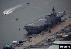 Japan Maritime Self-Defense Force's (JMSDF) latest Izumo-class helicopter carrier DDH-184 Kaga is moored at a naval base in Sasebo, on the southwest island of Kyushu, Japan April 6, 2018.