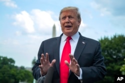 FILE - President Donald Trump speaks to reporters on the South Lawn before leaving the White House in Washington, May 20, 2019.