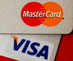 FILE - MasterCard and VISA credit cards are seen in this illustrative photograph taken in Hong Kong, Dec. 8, 2010.