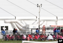 Immigrant children are shown outside a former Job Corps site that now houses them, in Homestead, Florida, June 18, 2018. The U.S. in the last six weeks has separated more than 2,300 young children from their families at the U.S.-Mexico border.