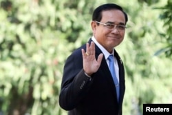 FILE - Thailand's Prime Minister Prayuth Chan-ocha gestures as he leaves after a meeting at Government House in Bangkok, Thailand, Jan. 24, 2019.