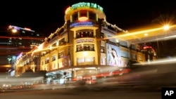 FILE - American companies signs including Motorola, Citybank are seen around Saigon Tax Trade Center, a shopping center, in Ho Chi Minh City in Vietnam, Nov. 2, 2007.