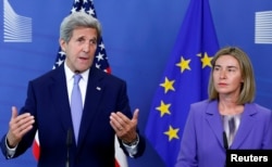 U.S. Secretary of State John Kerry and European Union foreign policy chief Federica Mogherini (R) address a joint news conference after their meeting at the EU Commission headquarters in Brussels, Belgium, June 27, 2016.