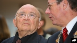 FILE - Israeli author Aharon Appelfeld, left, sits next to Dortmund's mayor, Gerhard Langemeyer, during the award ceremony of the Nelly-Sachs award for Appelfeld's career in Dortmund, Germany, Dec. 4, 2005.
