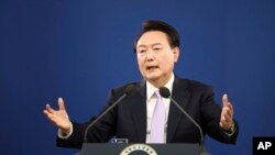 FILE - South Korean President Yoon Suk Yeol answers a reporter's question during a news conference at the Presidential Office in Seoul, South Korea, Nov. 7, 2024. 