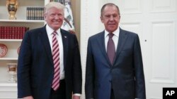 President Donald Trump meets with Russian Foreign Minister Sergey Lavrov, right, at the White House in Washington, May 10, 2017.