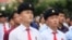 FILE - People watch a news broadcast on a missile launch in Pyongyang, North Korea, July 29, 2017. North Korean leader Kim Jong Un said the second flight test of an intercontinental ballistic missile demonstrated his country could hit the U.S. mainland.