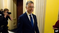 FILE - Kurt Volker, a former special envoy to Ukraine, walks through the Capitol in Washington, Oct. 3, 2019.