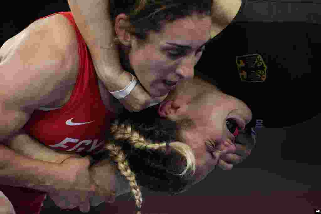 Germany's Anna Carmen Schell, right, reacts during her batlle against Egypt's Enas Ahmed at the women's 68kg freestyle wrestling match at the 2020 Summer Olympics in Chiba, Japan.