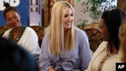 White House senior adviser Ivanka Trump, center, smiles at Azalech Tesfaye, right, who is the recipient of loan guarantee through USAID, as Trump meets women who work in the Ethiopian coffee industry, Sunday April 14, 2019, at Dumerso Coffee in Addis Ababa, Ethiopia. 