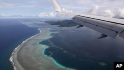 U.S. Secretary of State Mike Pompeo's plane makes its landing approach on Pohnpei International Airport in Kolonia, Federated States of Micronesia August 5, 2019. REUTERS/Jonathan Ernst/File Photo/File Photo