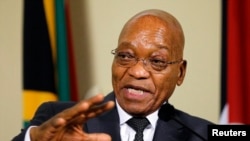 FILE - South Africa's President Jacob Zuma gestures during a media briefing in Pretoria, Nov. 26, 2014. 