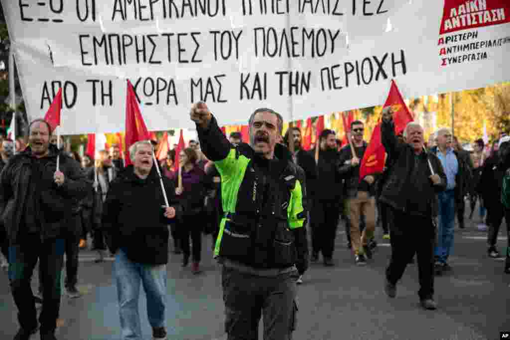 Protesters chant slogans during an anti-U.S. rally, in Athens, Jan. 11, 2020. Hundreds marched to the U.S. Embassy opposing any intervention from the U.S. against Iran. 