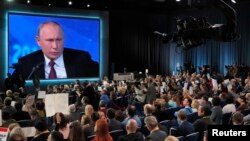 Russian President Vladimir Putin speaks during annual news conference in Moscow, Russia, Dec. 20, 2018. 