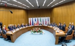 FILE - Participants of the Iran nuclear talks that culminated in the signing of the Joint Comprehensive Plan of Action (JCPOA), are pictured during a meeting at the United Nations building in Vienna, Austria, July 14, 2015.