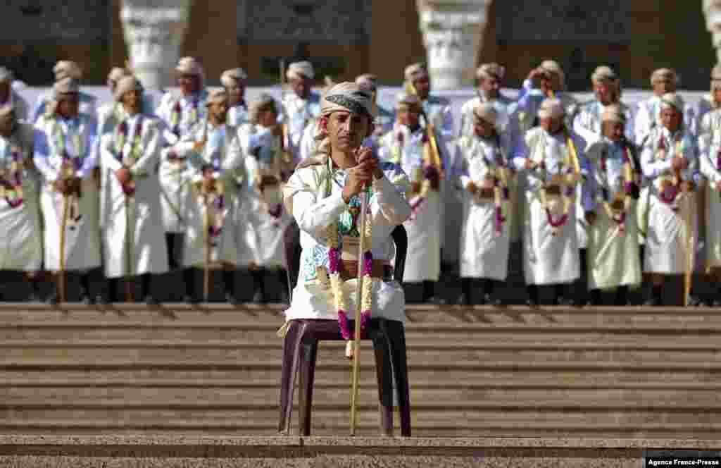 A leg-amputee groom along with others dressed in traditional Yemeni garb attend a mass wedding for 1,000 couples organized by the Huthi-held Zakat authority in Yemen's capital Sana'a.