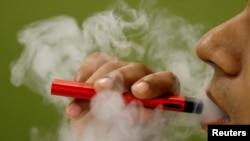 FILE - So far, investigators have not identified a particular device, liquid or ingredient behind the U.S. outbreak of severe vaping-related illnesses. 
