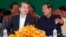 Cambodian Prime Minister Hun Sen, right, talks with Chinese Ambassador to Cambodia Xiong Bo, front left, during an inauguration ceremony of a sky bridge funded by China in Phnom Penh, July 2, 2018. 