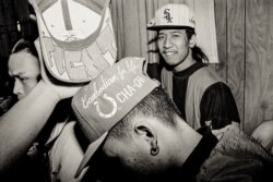 Cambodian Gino smiles as he hangs out with his friends in Uptown, Chicago. (Photo: Stuart Isett)
