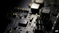 This Feb 23, 2019, file photo shows the inside of a computer in Jersey City, N.J. (AP Photo/Jenny Kane, File)