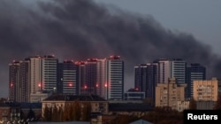 Smoke rises in the sky over the city after a Russian drone strike, amid Russia's attack on Ukraine, in Kyiv, Ukraine, November 7, 2024. 