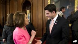 FILE - House Speaker Paul Ryan talks with House Minority Leader Nancy Pelosi on Capitol Hill in Washington, Dec. 8, 2016.