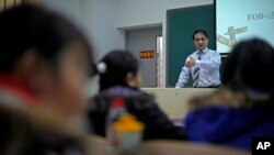 FILE - Economist Ilham Tohti speaks to students at the Central Nationalities University in Beijing, China. 