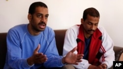 FILE - In this March 30, 2019, file photo, Alexanda Amon Kotey, left, and El Shafee Elsheikh, who were allegedly among four British jihadis who made up a brutal Islamic State cell dubbed "The Beatles," speak during an interview with The Associated Press…