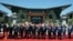 Leaders attending the Belt and Road Forum wave as they pose for a group photo at the Yanqi Lake venue on the outskirt of Beijing, China, May 15, 2017. 