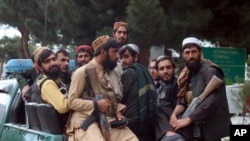 Taliban fighters arrive inside the Hamid Karzai International Airport after the U.S. military's withdrawal, in Kabul, Afghanistan, Aug. 31, 2021.