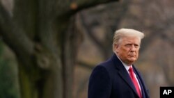 President Donald Trump walks on the South Lawn of the White House in Washington before boarding Marine One, Dec. 12, 2020.
