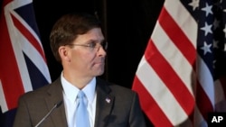 FILE - U.S. Secretary of Defense Mark Esper briefs the media following annual bilateral talks with Australian counterparts in Sydney, Australia, Aug. 4, 2019. 